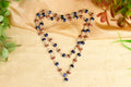 Rudraksha & Blue Sapphire Silver Flower Caps
Mala